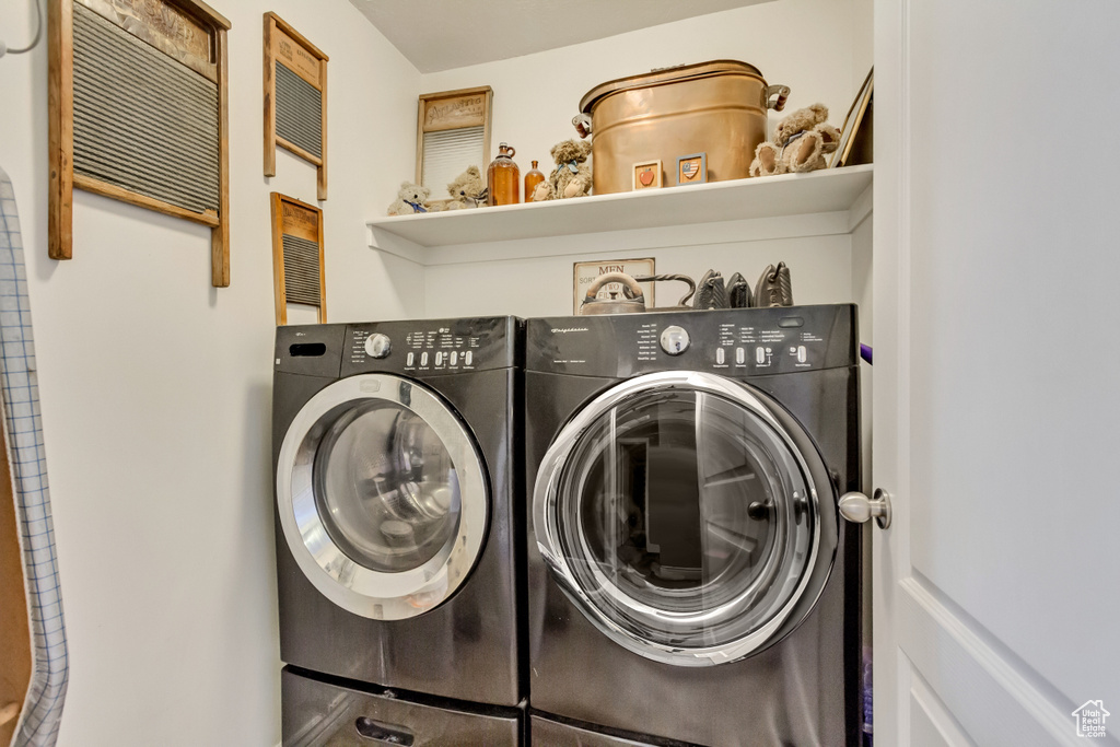 Laundry room featuring laundry area and washing machine and clothes dryer
