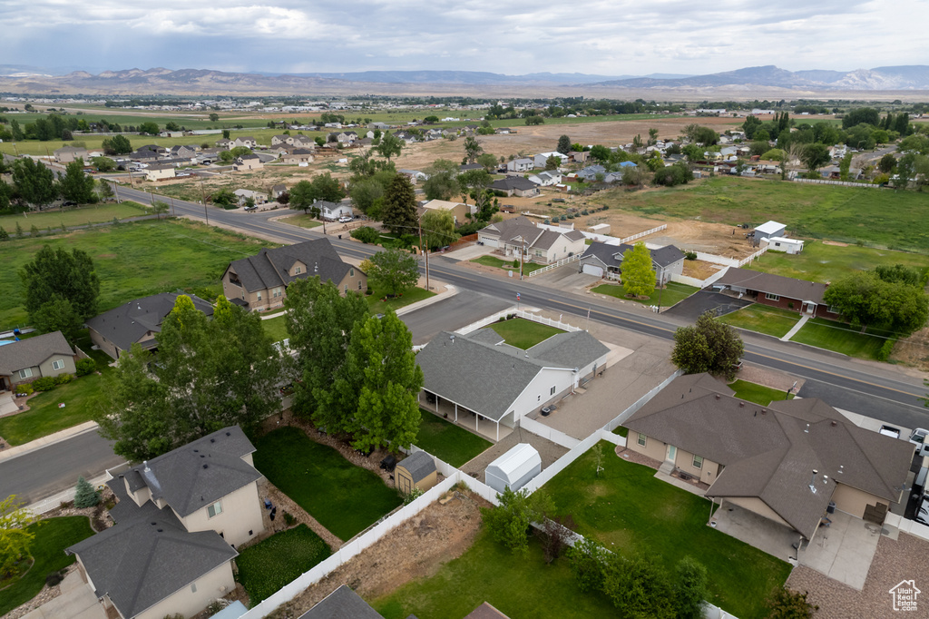 Aerial perspective of suburban area featuring a mountain backdrop