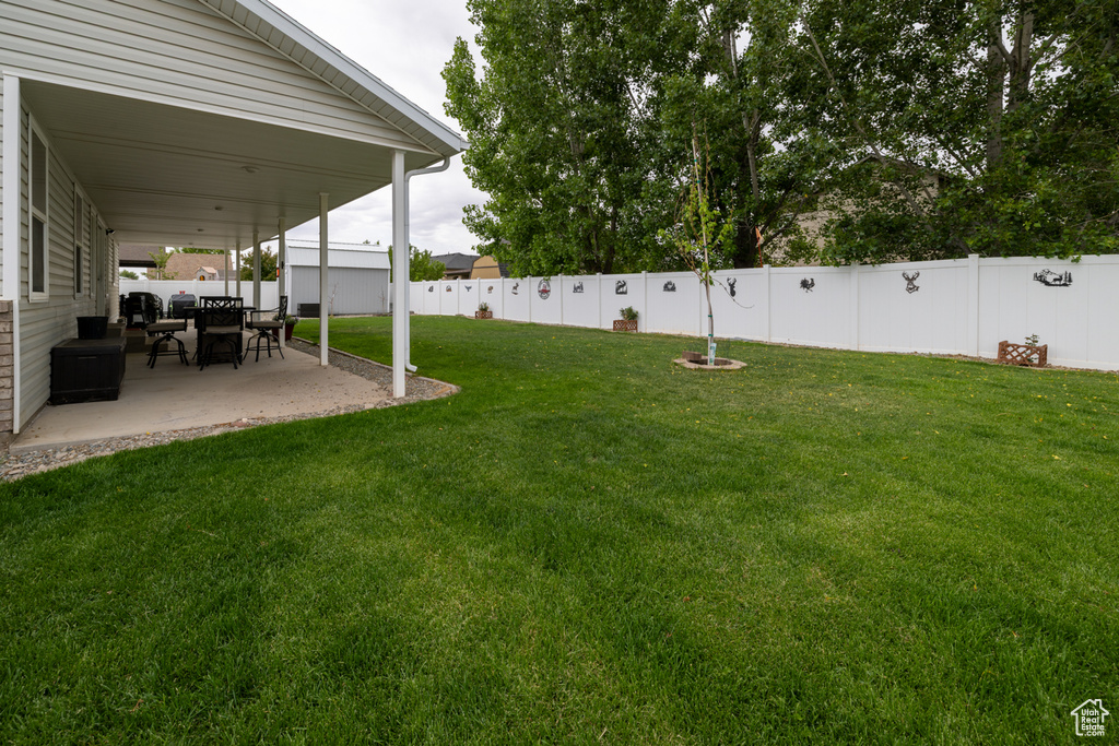 View of yard with a patio
