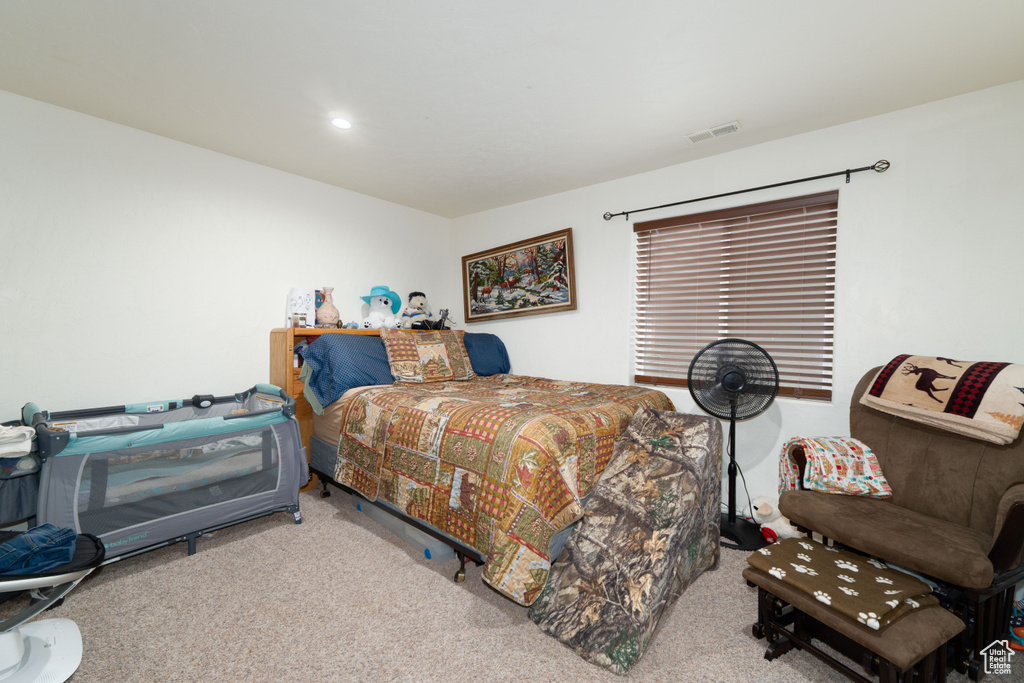 Bedroom with recessed lighting, visible vents, and carpet floors