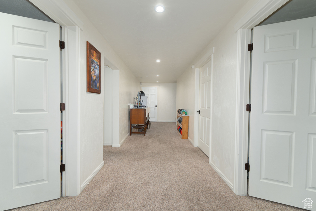 Corridor featuring carpet flooring, recessed lighting, and baseboards