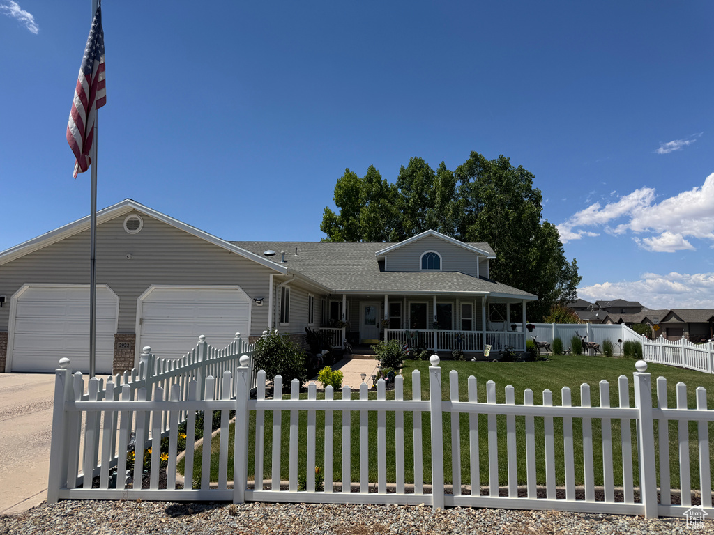 Ranch-style house featuring covered porch, a garage, roof with shingles, and concrete driveway