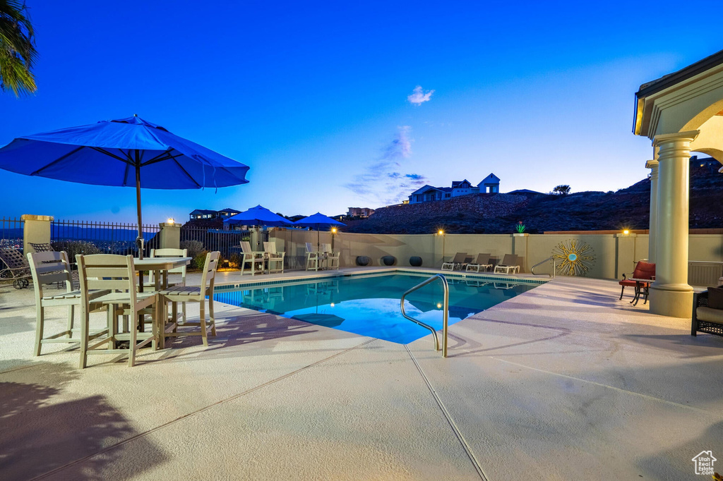 View of pool featuring a patio, fence, and a fenced in pool