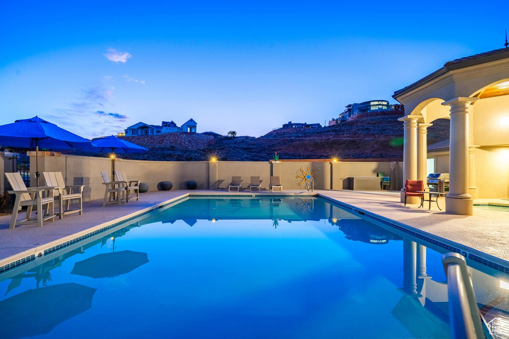 View of pool featuring a fenced in pool and a patio