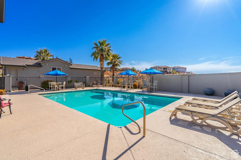 View of pool featuring a fenced in pool, a patio area, and fence