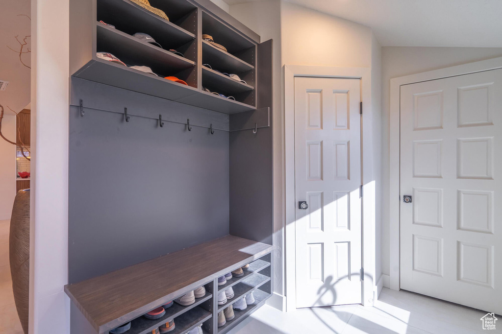 Mudroom featuring visible vents and vaulted ceiling
