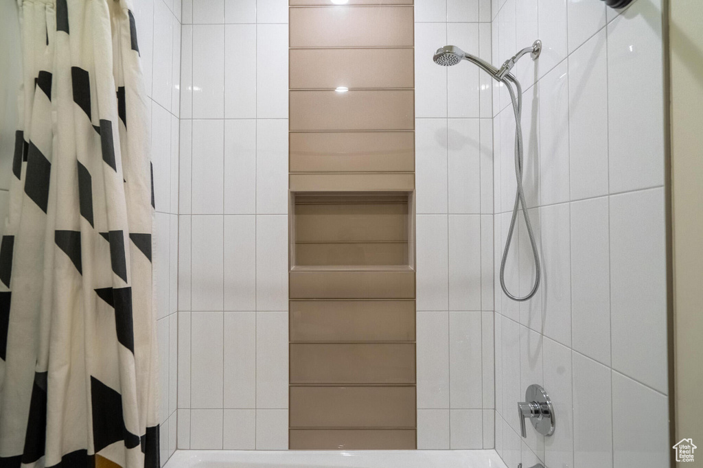 Full bathroom with shower / tub combo with curtain