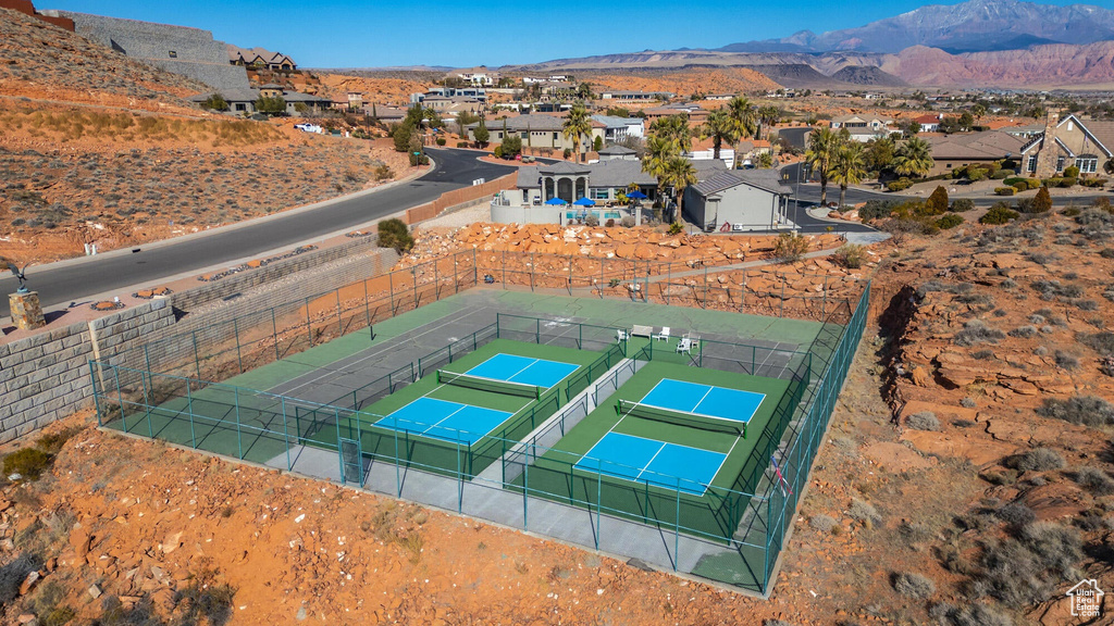 Birds eye view of property with a mountain view and a residential view