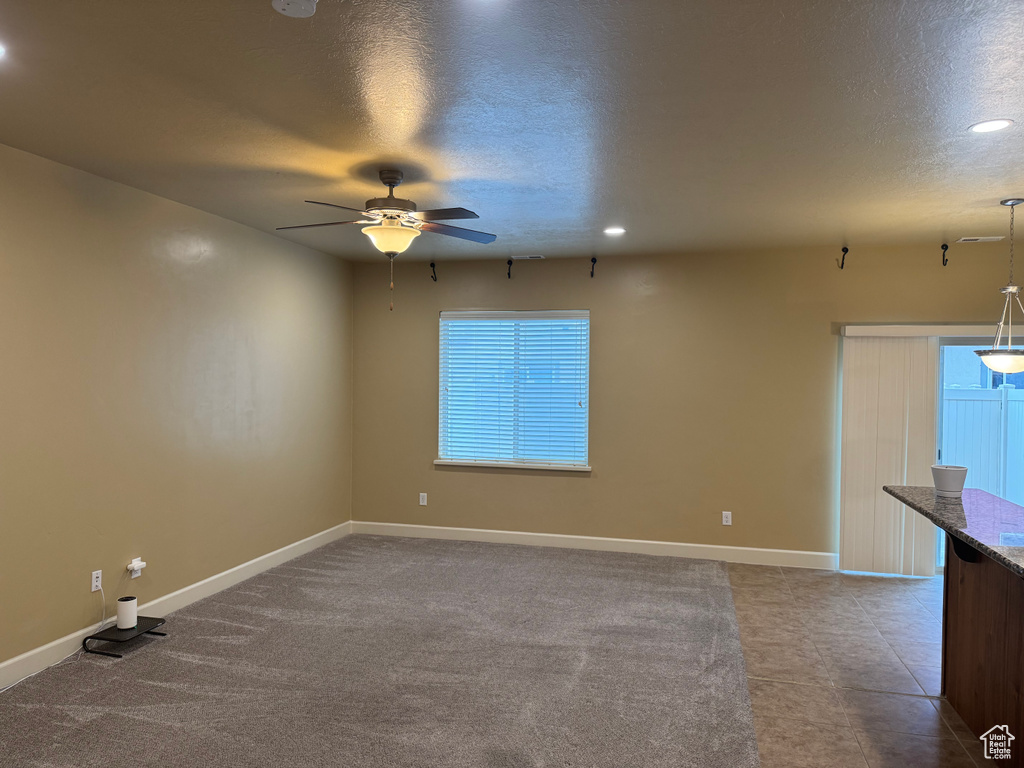 Spare room with baseboards, recessed lighting, ceiling fan, and a textured ceiling
