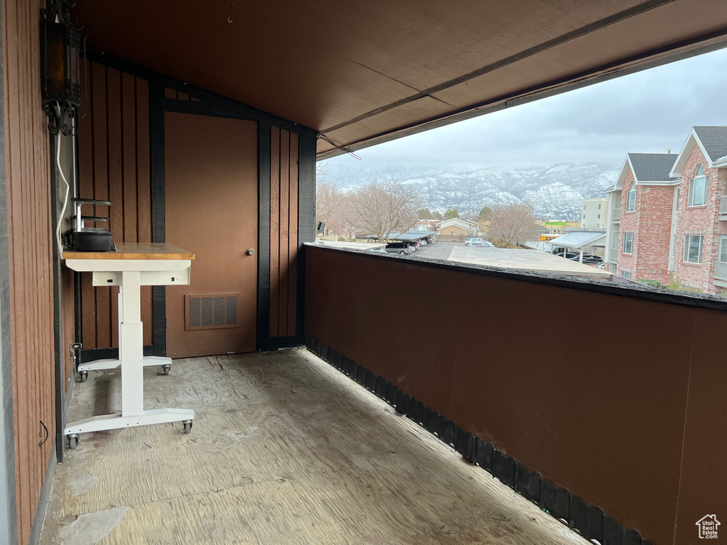 Balcony featuring visible vents and a mountain view