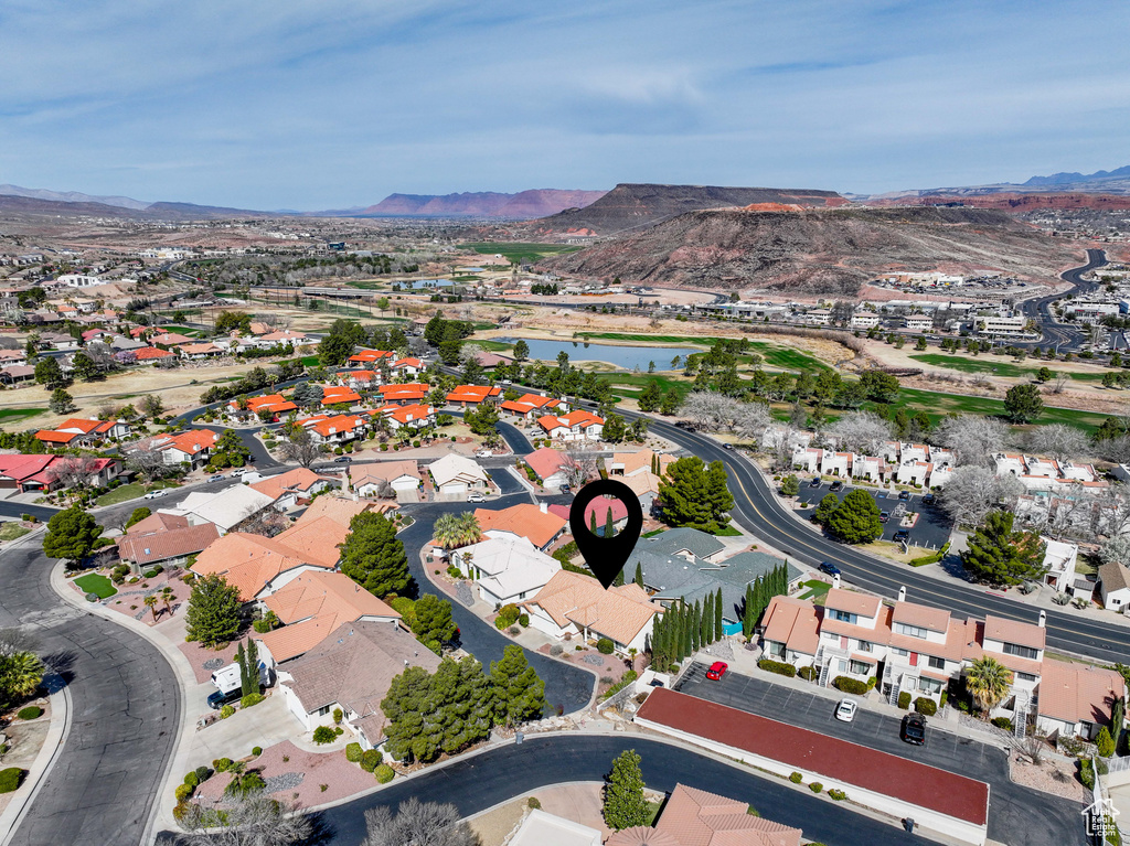 Birds eye view of property with a residential view and a water and mountain view