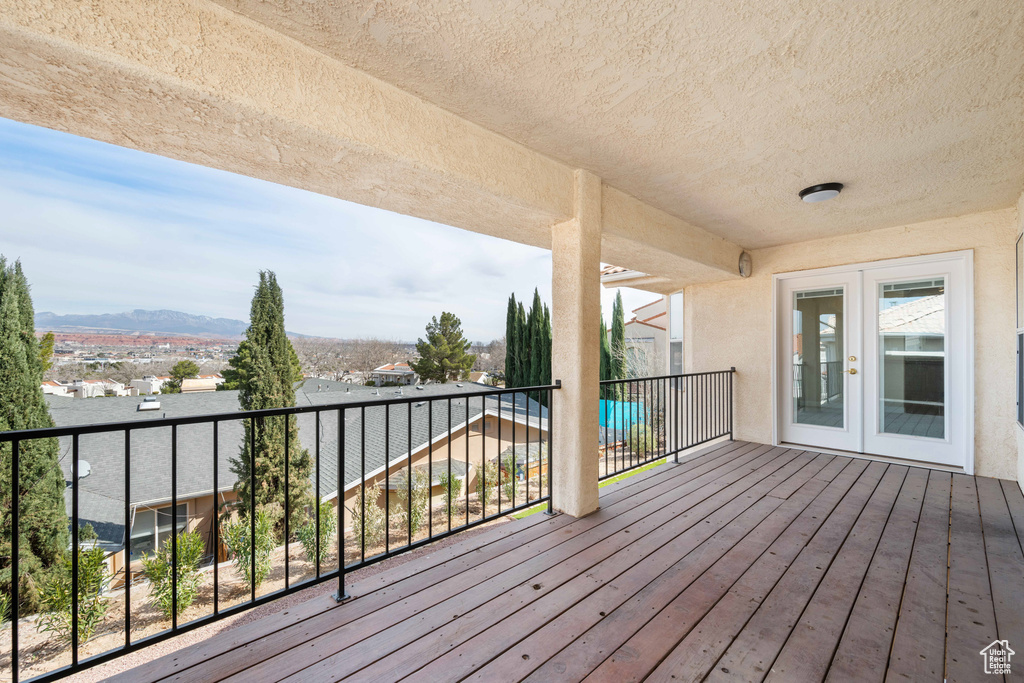 Wooden terrace with a mountain view and french doors
