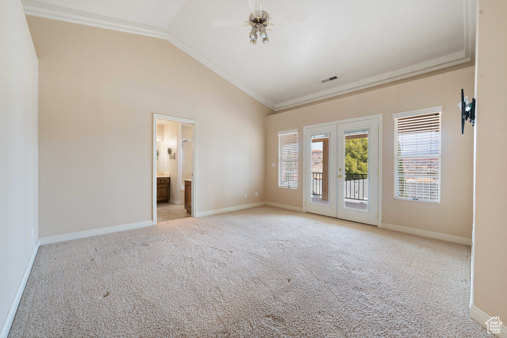 Interior space featuring visible vents, light carpet, ornamental molding, french doors, and baseboards