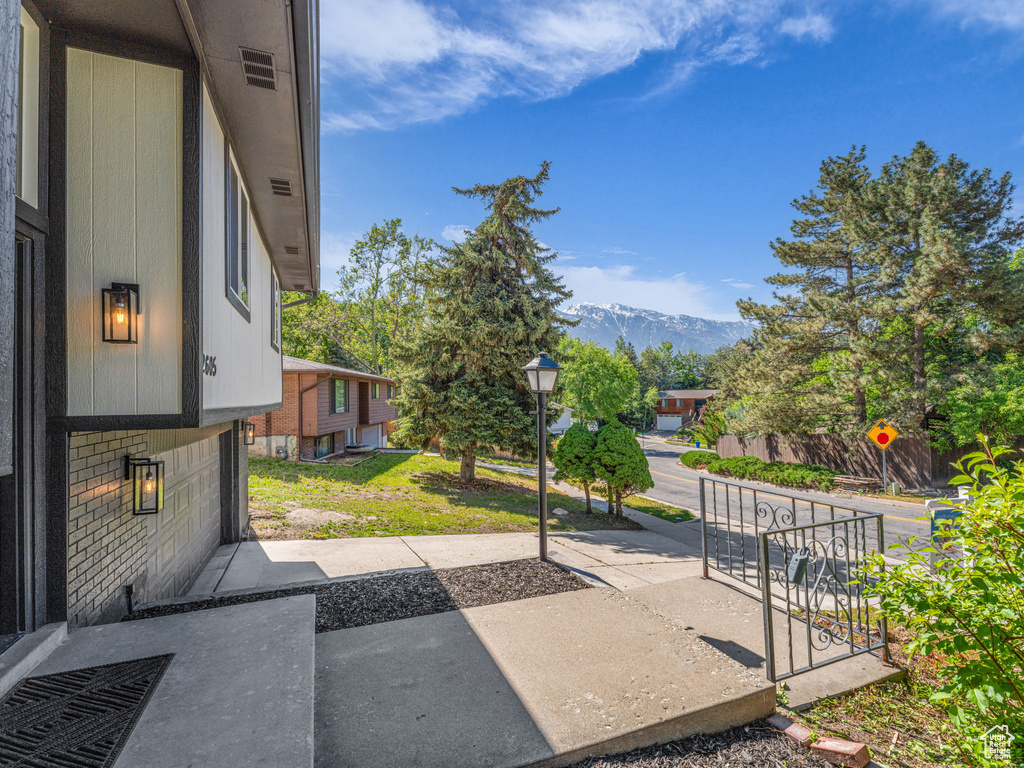 View of yard featuring a mountain view and a patio area