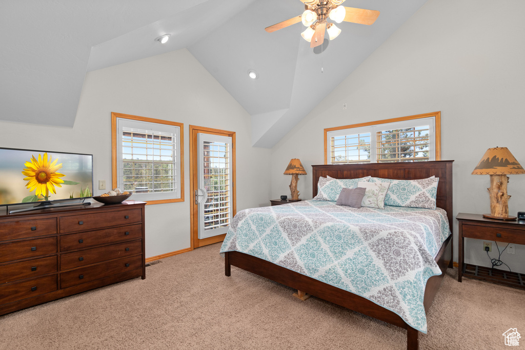 Bedroom featuring baseboards, lofted ceiling, ceiling fan, access to exterior, and light colored carpet