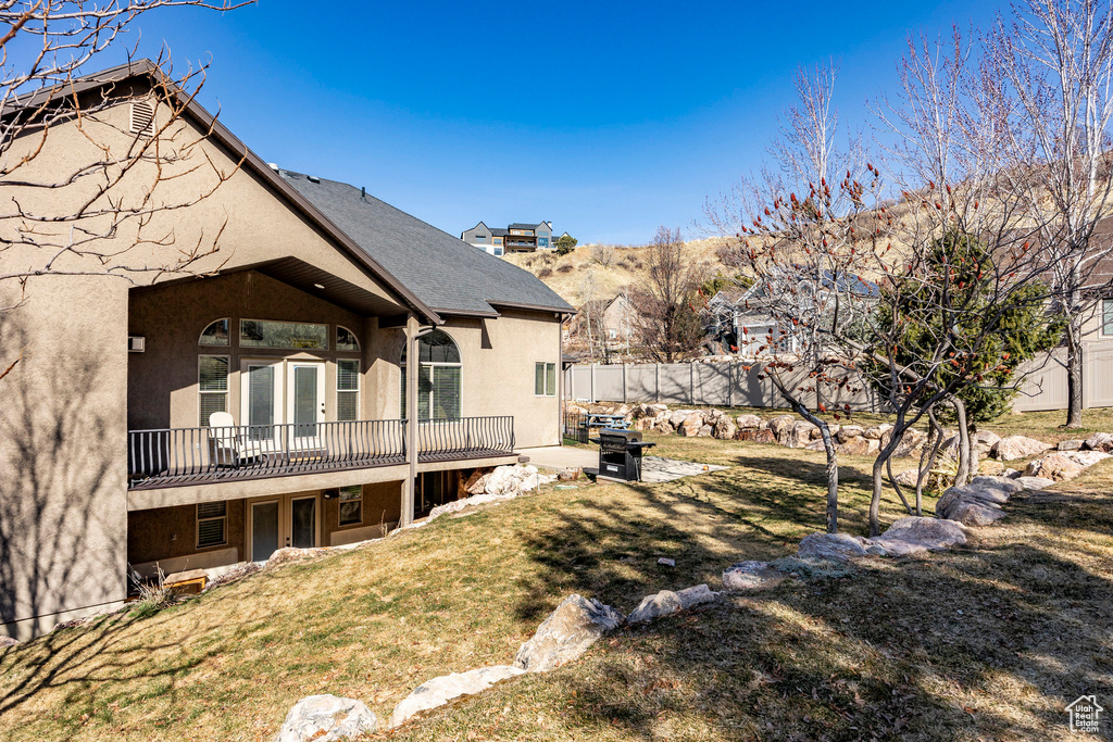 View of yard featuring a deck with mountain view