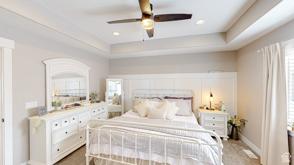 Bedroom featuring visible vents, recessed lighting, baseboards, light colored carpet, and ceiling fan