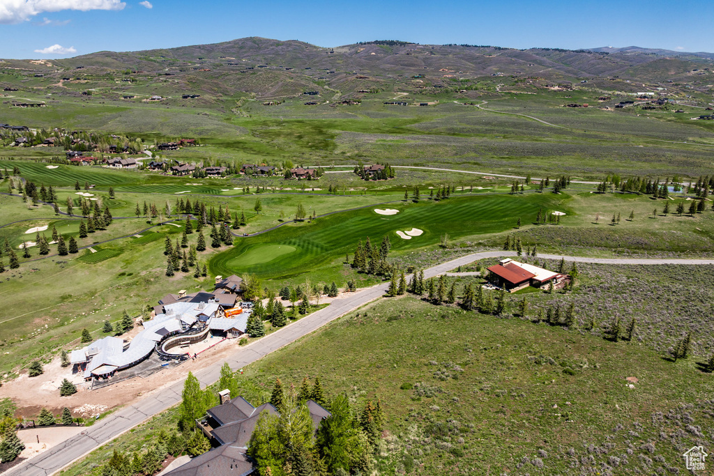 View of property location featuring mountains and a local golf course