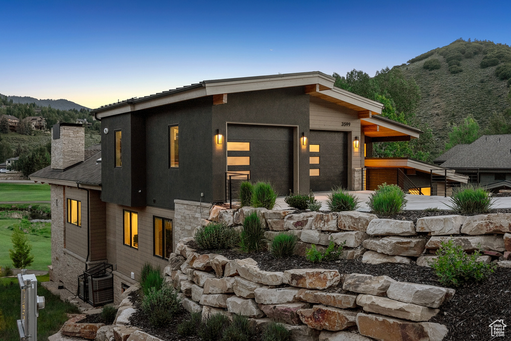 Modern home with a mountain view and a chimney