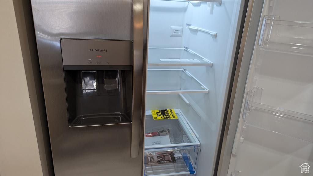 Room details with refrigerator with ice dispenser