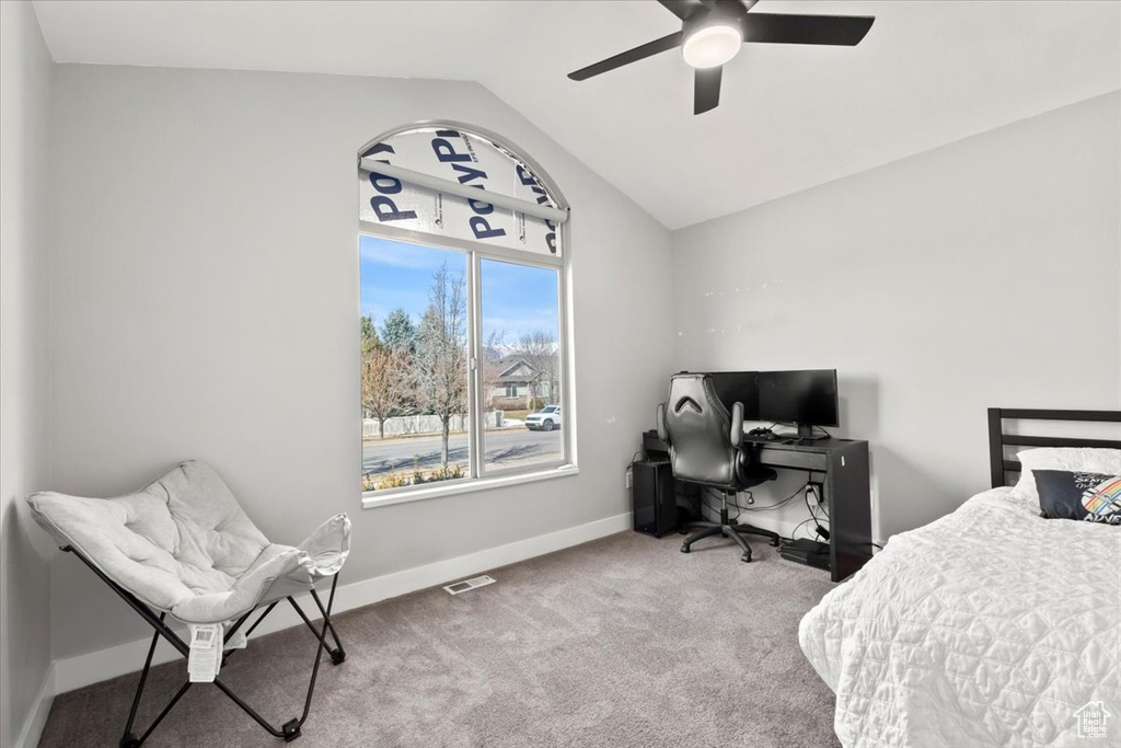 Bedroom featuring a ceiling fan, carpet, baseboards, visible vents, and vaulted ceiling