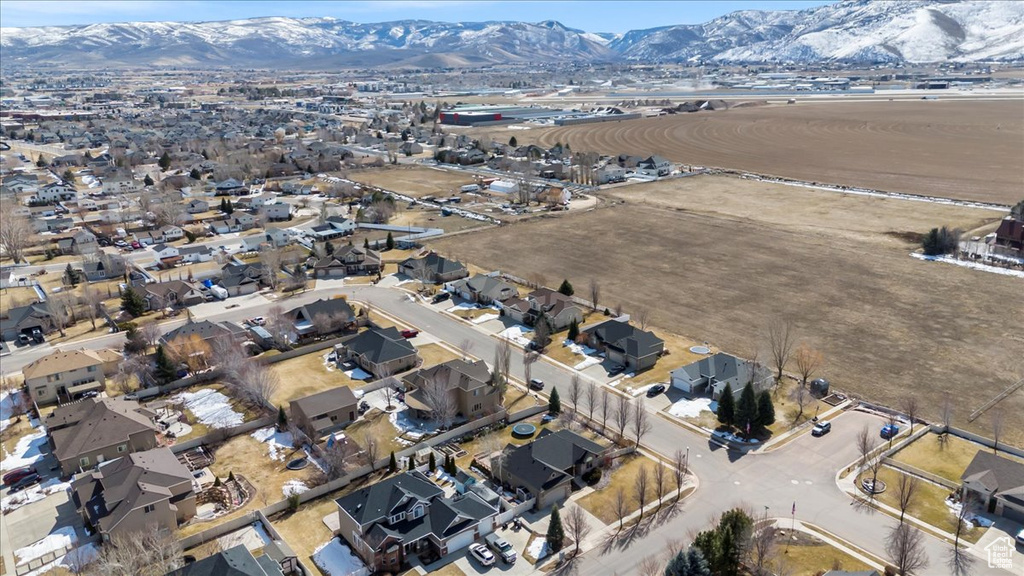 Birds eye view of property featuring a mountain view and a residential view