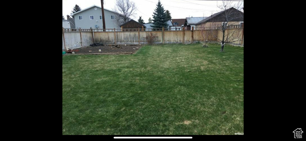 View of yard featuring a fenced backyard