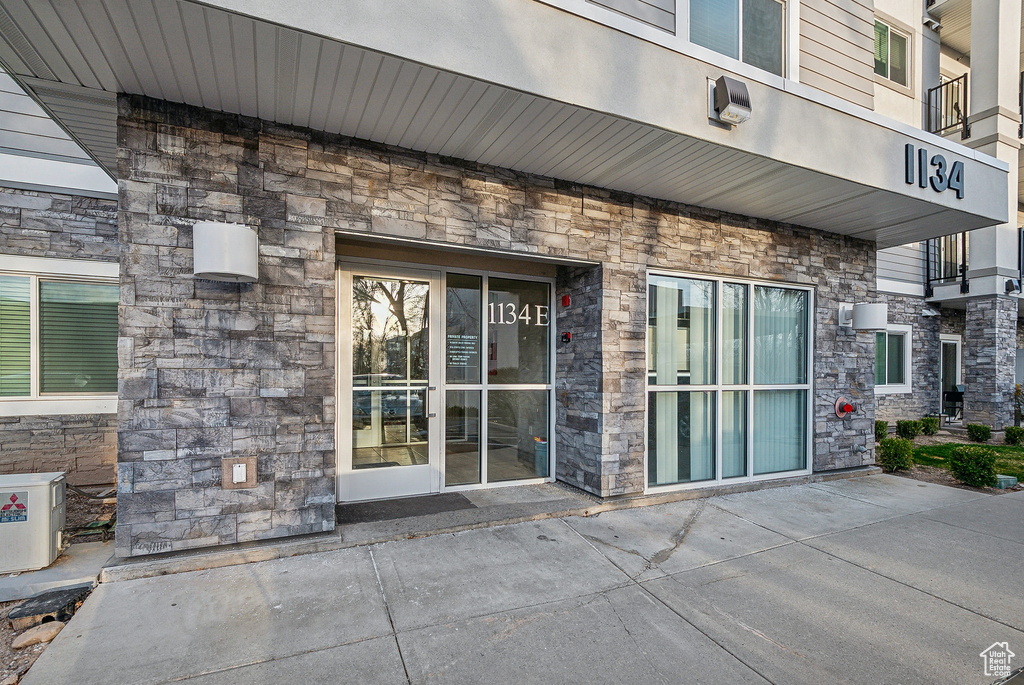 Property entrance with stone siding