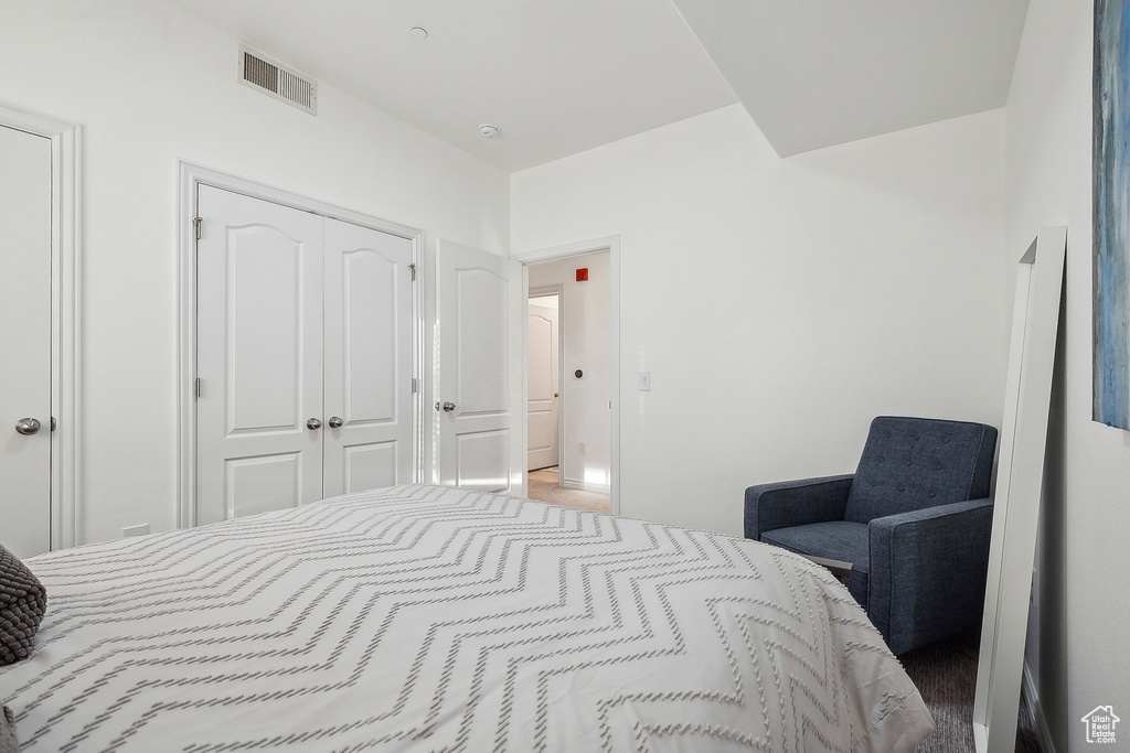 Bedroom with a closet and visible vents