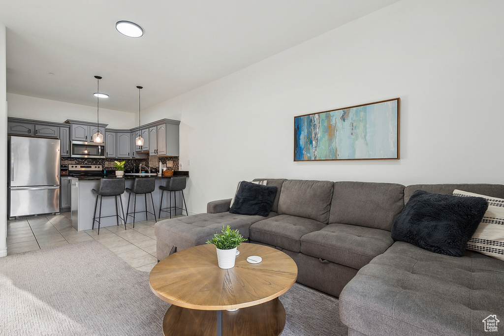 Living area featuring light tile patterned floors