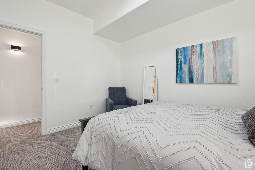 Bedroom with carpet and baseboards