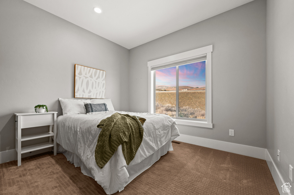 Bedroom featuring recessed lighting, baseboards, and carpet floors