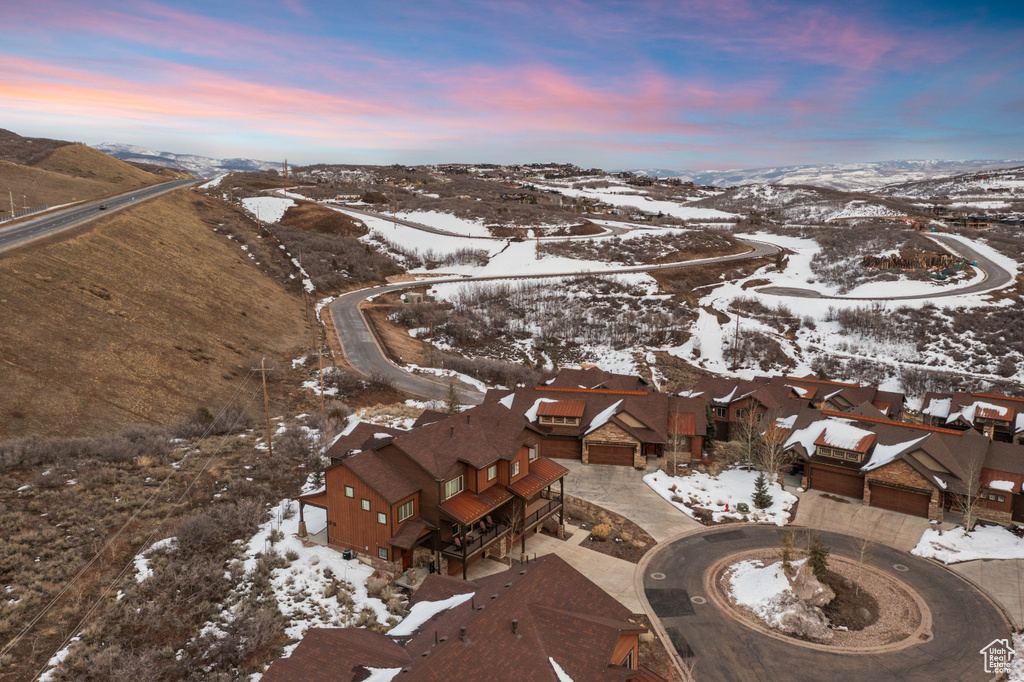 Snowy aerial view with a residential view