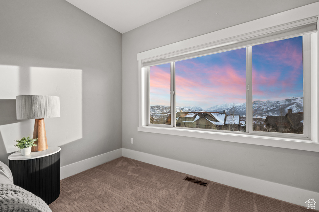 Sitting room featuring visible vents, baseboards, and carpet floors
