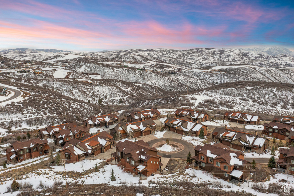 Snowy aerial view with a residential view and a mountain view