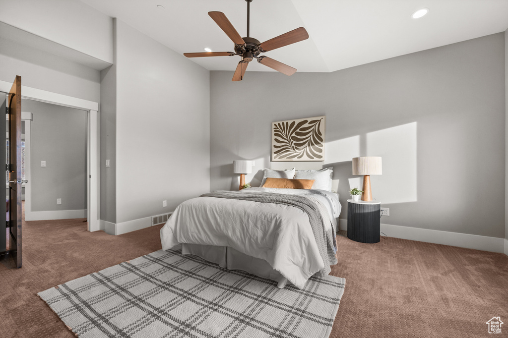 Bedroom featuring visible vents, recessed lighting, carpet floors, baseboards, and vaulted ceiling