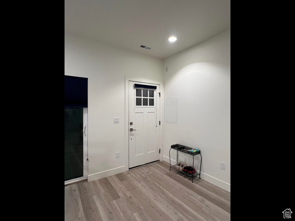 Foyer entrance featuring recessed lighting, light wood-type flooring, baseboards, and visible vents