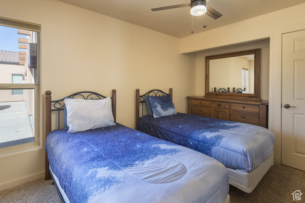 Bedroom featuring carpet flooring and a ceiling fan