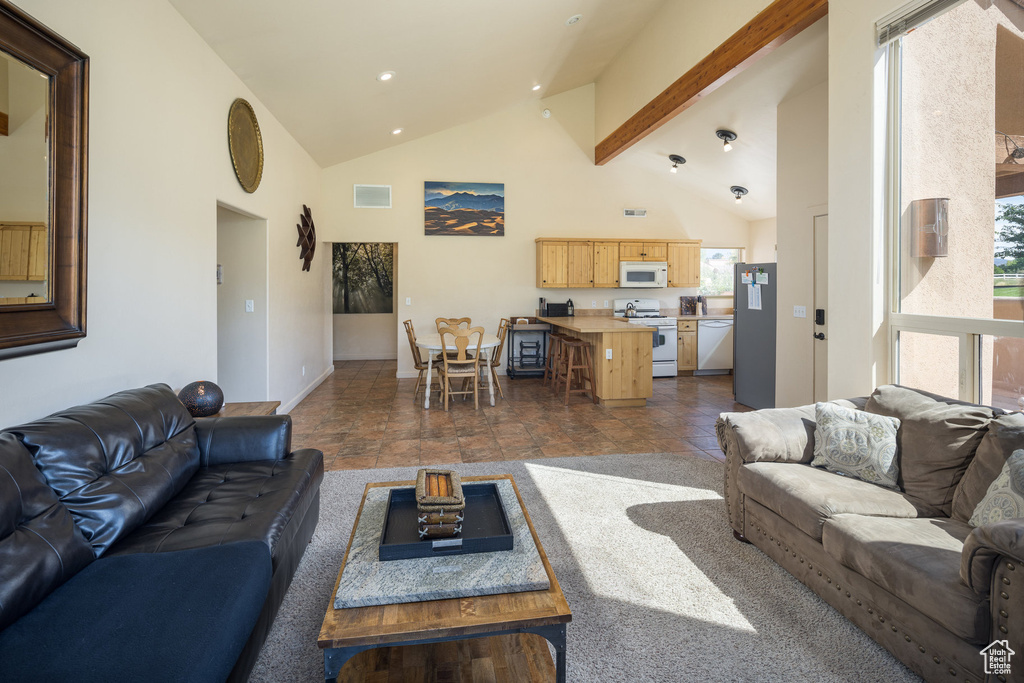 Living room featuring visible vents, beamed ceiling, high vaulted ceiling, recessed lighting, and baseboards