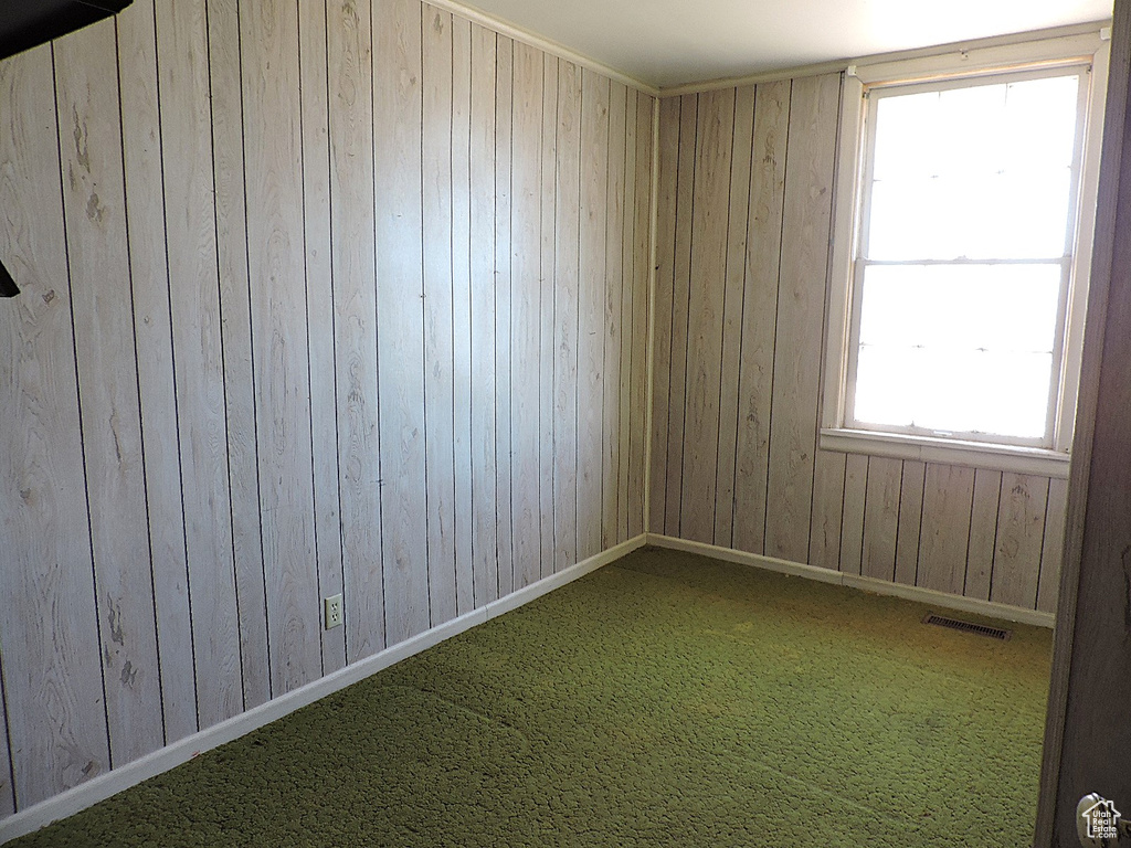 Empty room with baseboards and visible vents