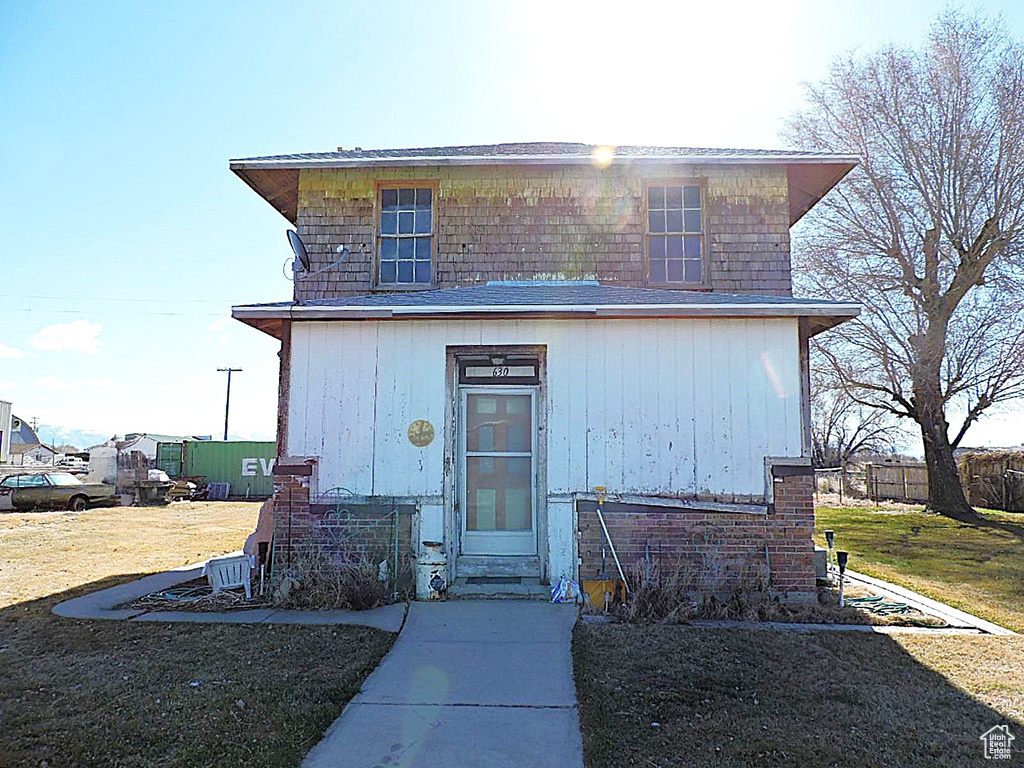 View of outbuilding with entry steps