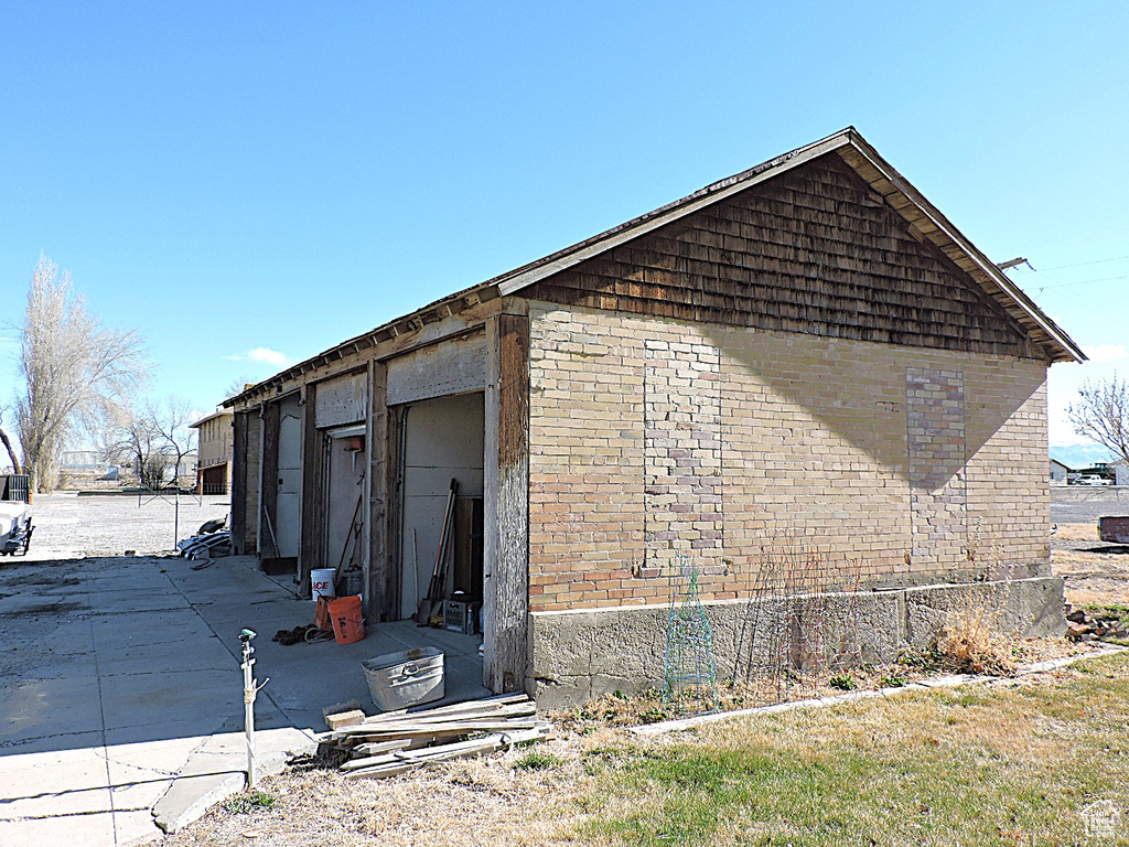 View of home\'s exterior with brick siding and a garage