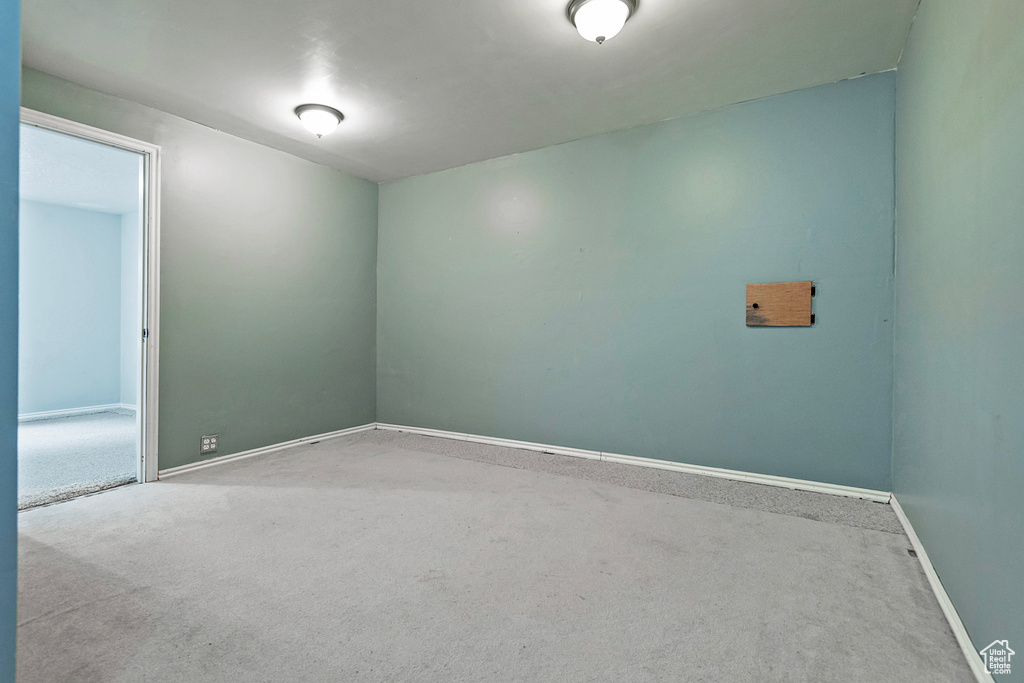 Unfurnished room with baseboards and carpet floors