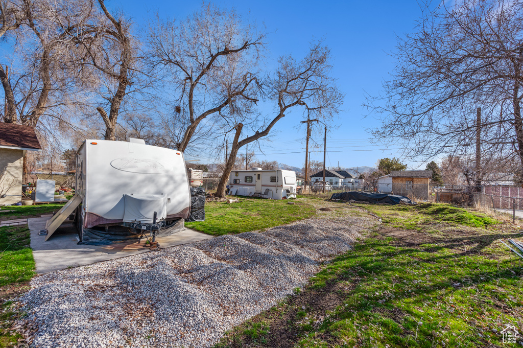 View of yard featuring fence