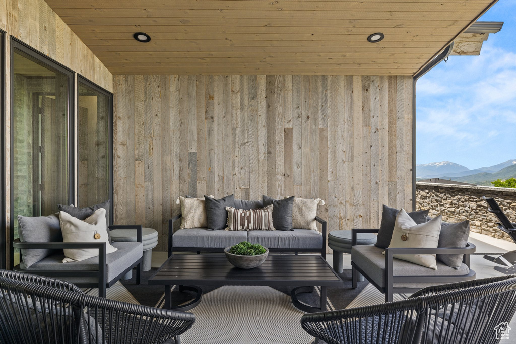 View of patio with outdoor lounge area and a mountain view