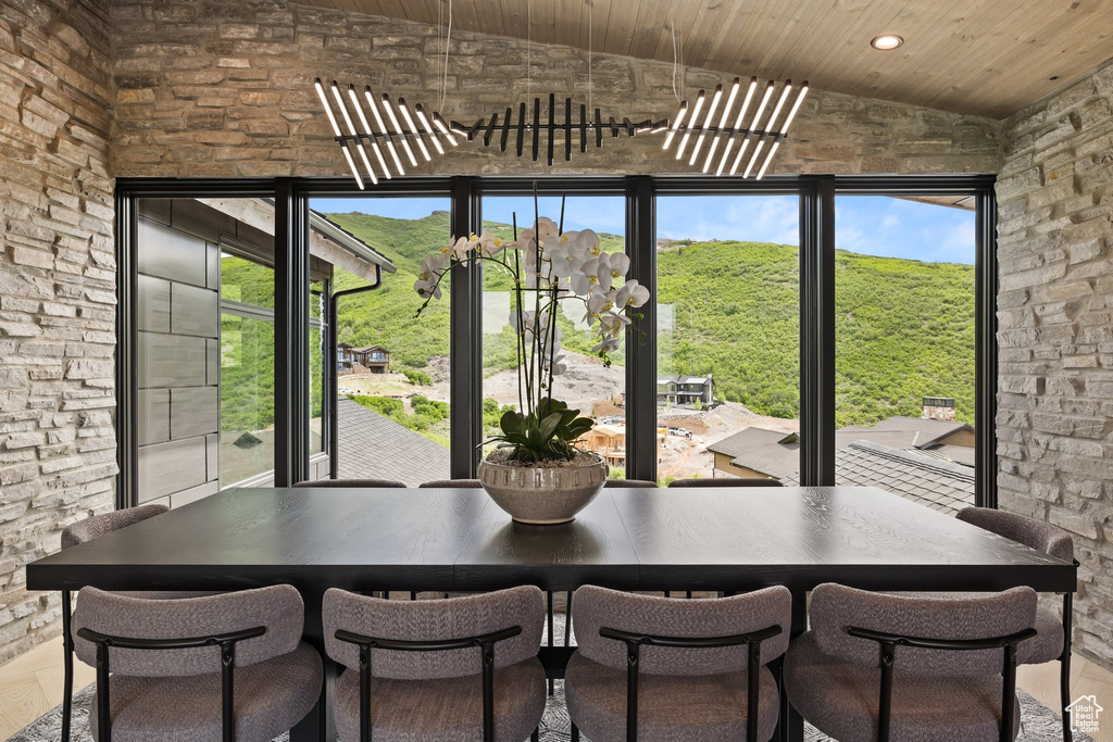 Dining area featuring wood ceiling, recessed lighting, and high vaulted ceiling