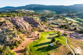 Bird\\\\\\\'s eye view of a mountainous background and a golf club