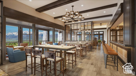 Dining space with wood finished floors, beam ceiling, and a chandelier