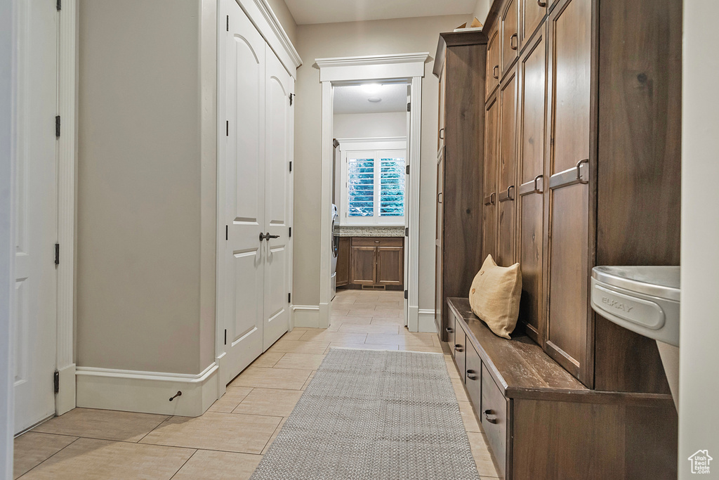 Mudroom featuring light tile patterned flooring