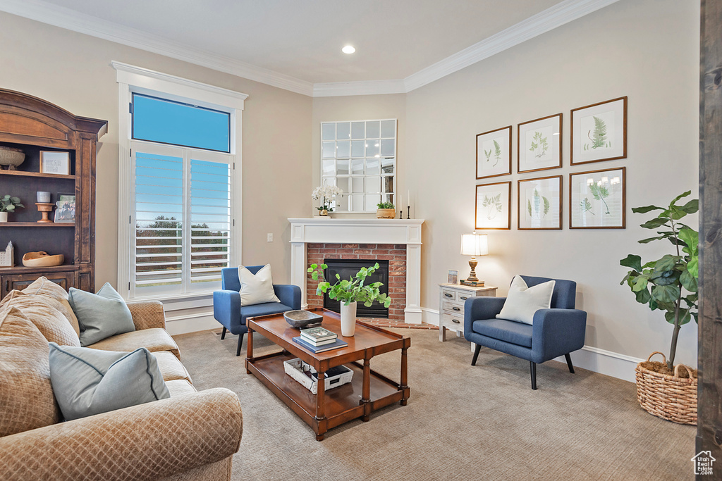 Living area featuring crown molding, a fireplace, baseboards, light carpet, and recessed lighting